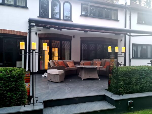 Art deco candelabras on deck outside a house