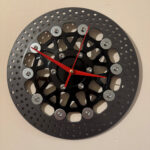 Clock made and upcycled from a motorcycle brake disc - red hands