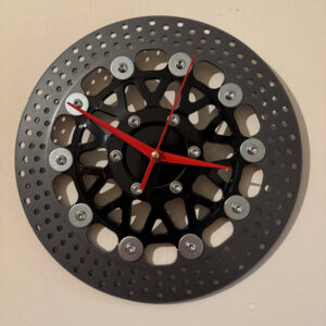 Clock made and upcycled from a motorcycle brake disc - red hands