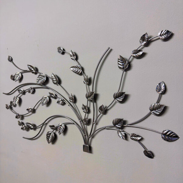 Intricate bramble leaf wall art with a smooth chrome effect finish on branches and leaves side on