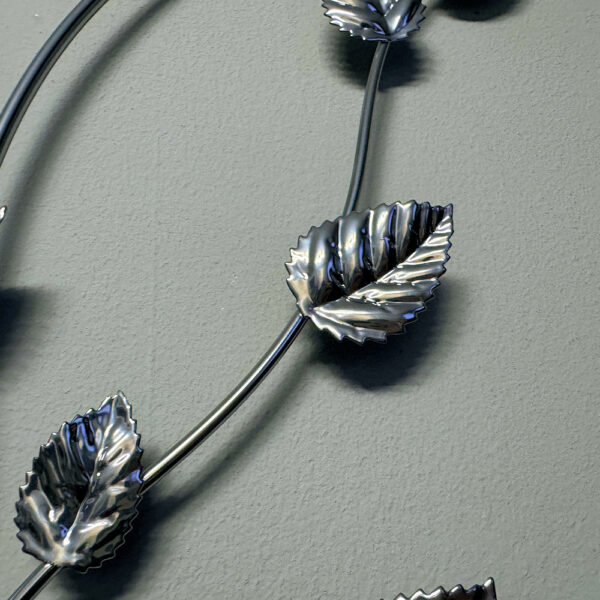 Decorative bramble leaf wall art with a polished chrome finish